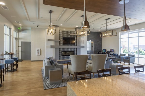 Modern clubhouse featuring upscale seating and entertainment options at The Victor Stonebridge Apartments