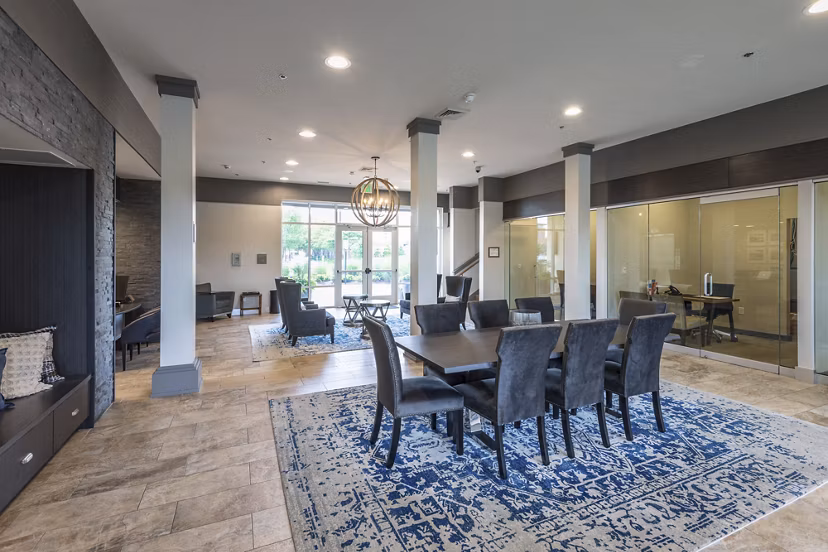 The Victor Stonebridge Apartments: Elegant clubhouse with contemporary design and cozy seating areas