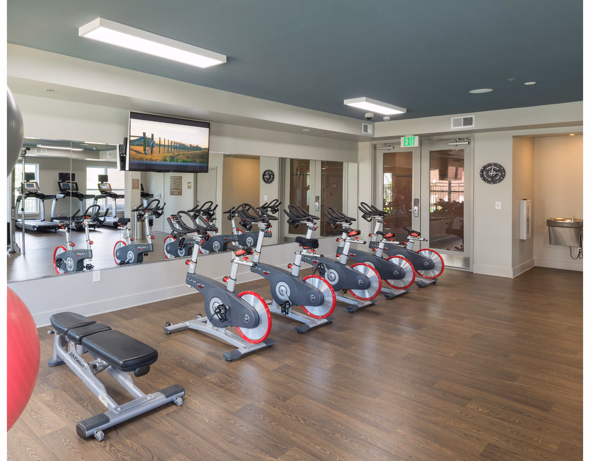 State-of-the-art fitness center featuring modern equipment at The Victor Stonebridge Apartments