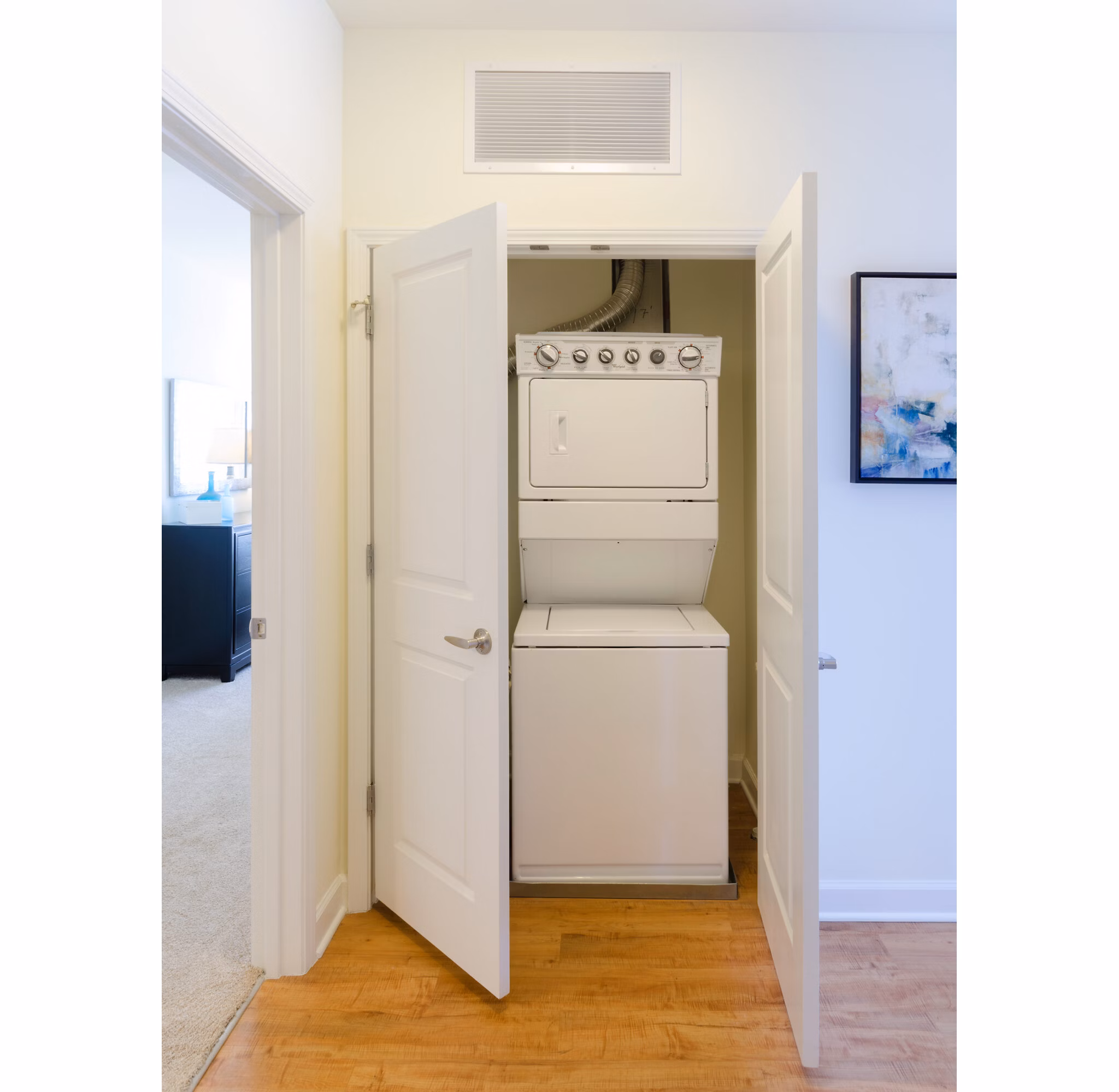 Laundry room with modern appliances at The Victor Stonebridge Apartments