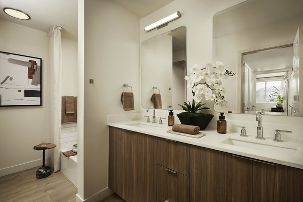 Bathroom featuring sleek countertops and modern fixtures at Dolphin Marina Apartments, luxury living by Greystar in a stunning waterfront location