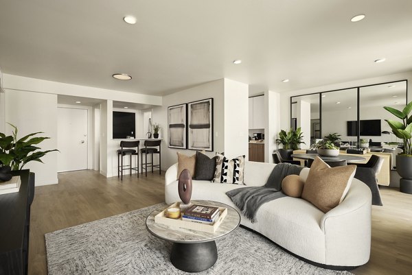 Clubhouse at Dolphin Marina Apartments: Modern lounge area with plush seating and stylish decor in vibrant coastal setting