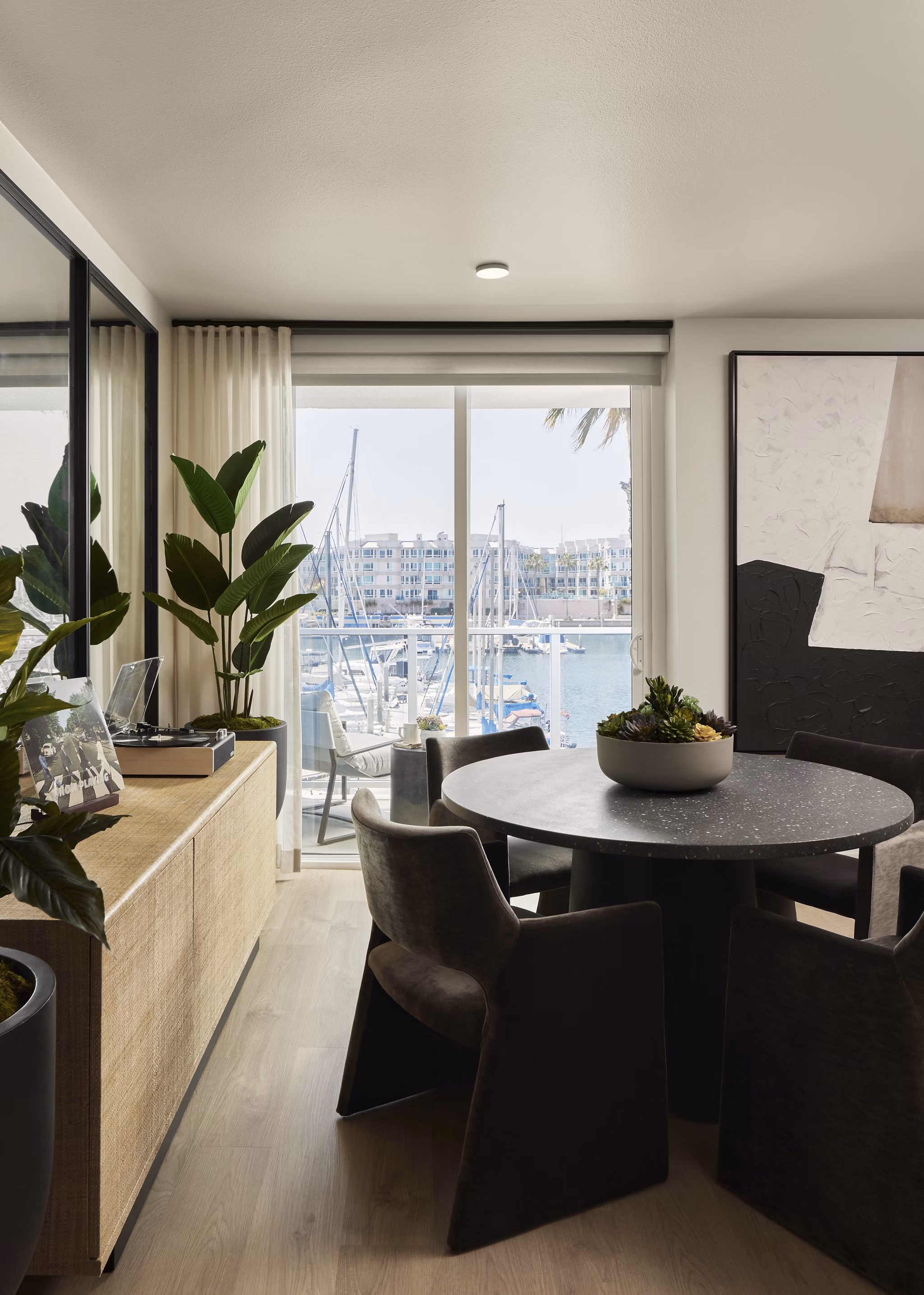 Dining room featuring elegant furnishings and modern lighting at Dolphin Marina Apartments