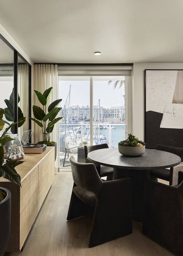 Dining room featuring elegant furnishings and modern lighting at Dolphin Marina Apartments