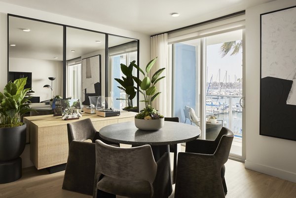 Dining room with modern furnishings at Dolphin Marina Apartments in Greystar's luxurious community