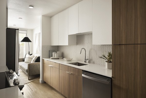 Modern kitchen with stainless steel appliances in Dolphin Marina Apartments, Los Angeles
