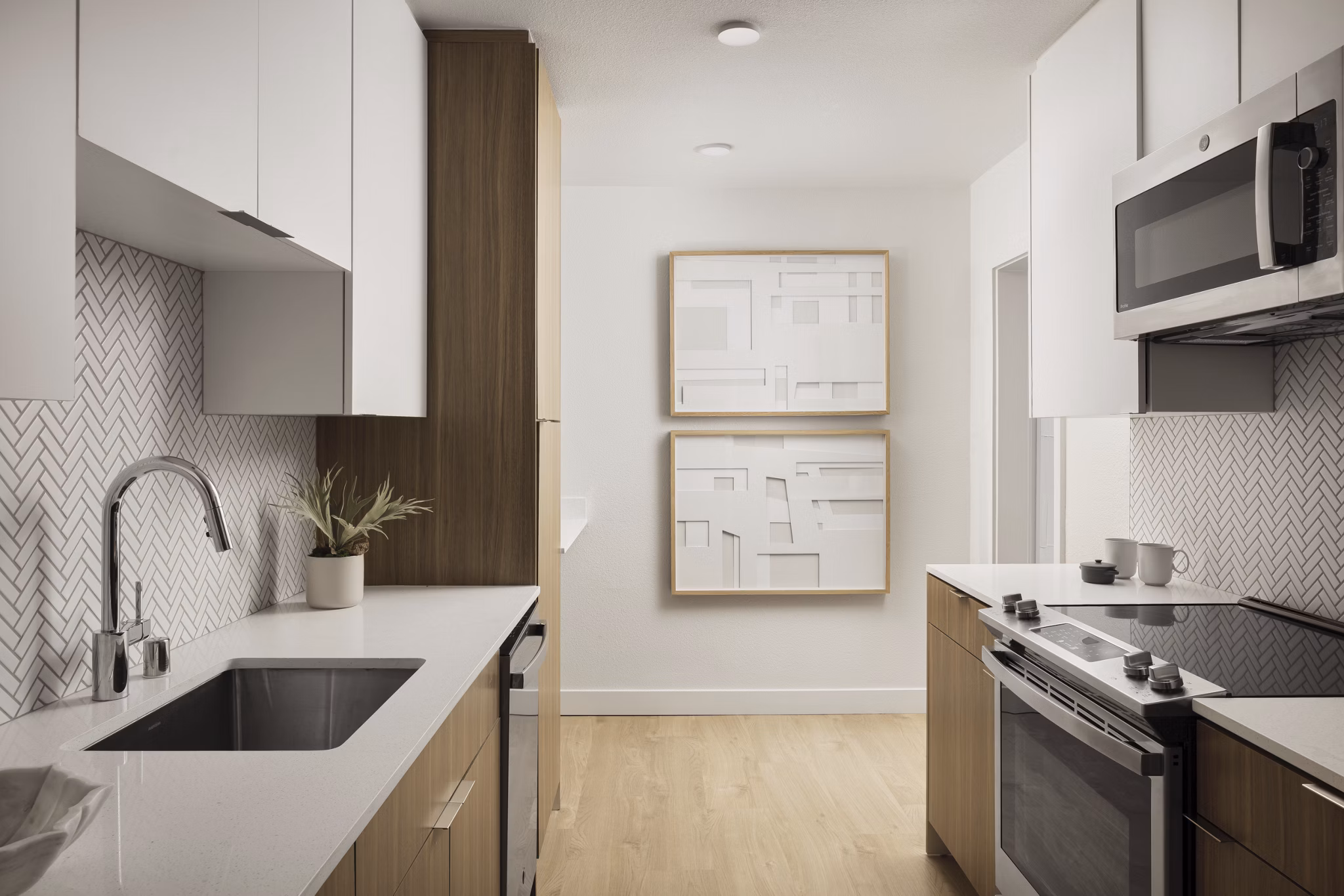 Modern kitchen with stainless steel appliances at Dolphin Marina Apartments in Los Angeles