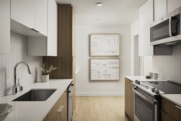Modern kitchen with stainless steel appliances at Dolphin Marina Apartments in Los Angeles