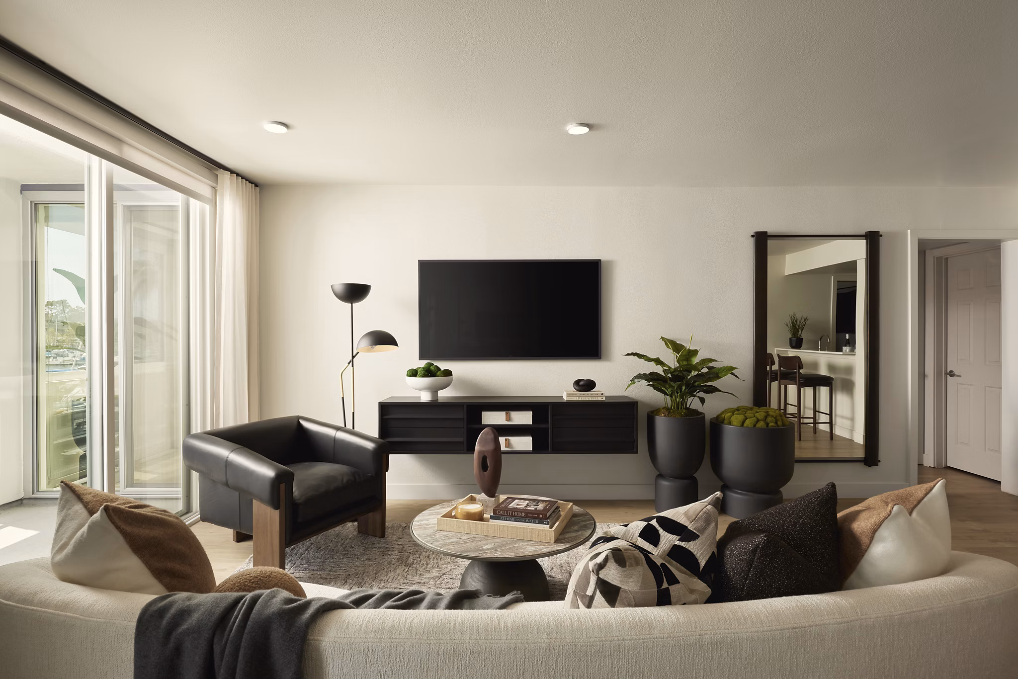 Spacious living room with modern furnishings at Dolphin Marina Apartments