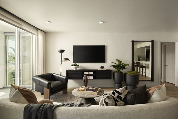 Spacious living room with modern furnishings at Dolphin Marina Apartments