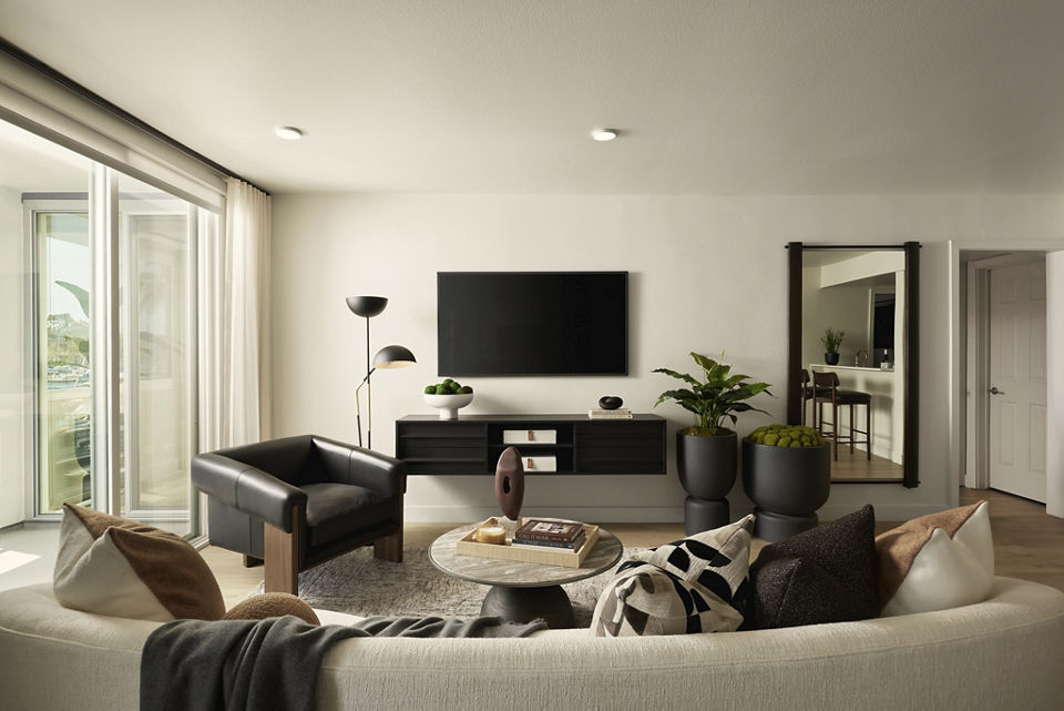 Spacious living room with modern furnishings at Dolphin Marina Apartments