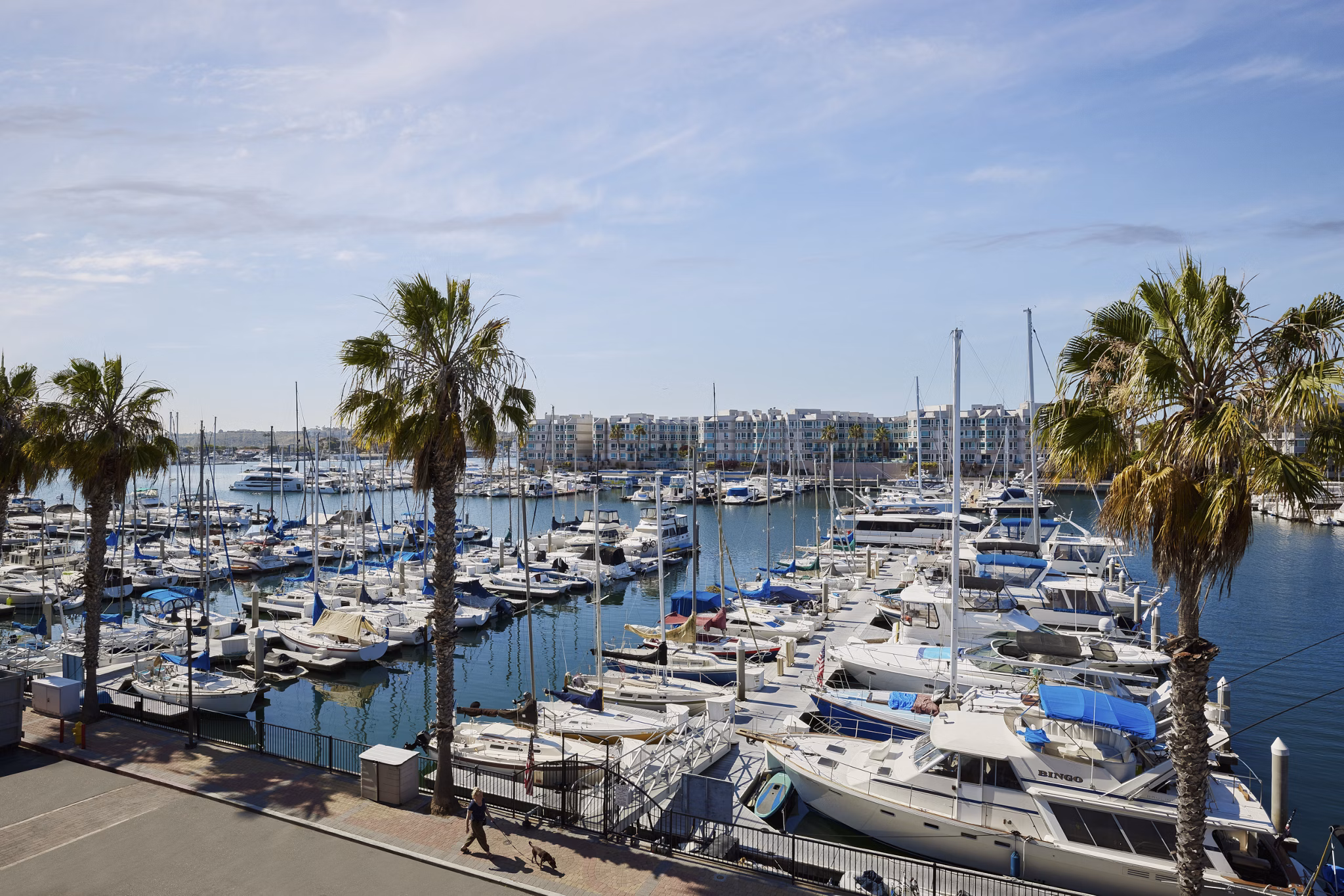 Spacious patio overlooking marina at Dolphin Marina Apartments