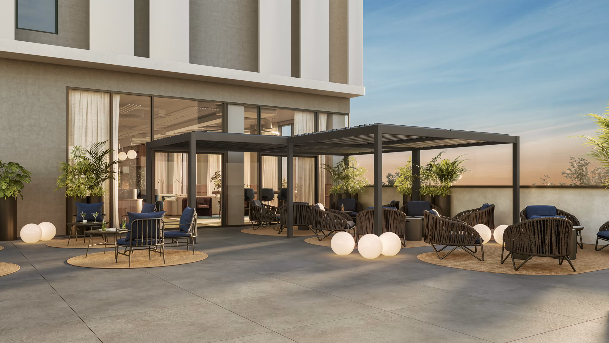 Sophisticated outdoor seating area with stylish furniture at Nera Living Atocha.