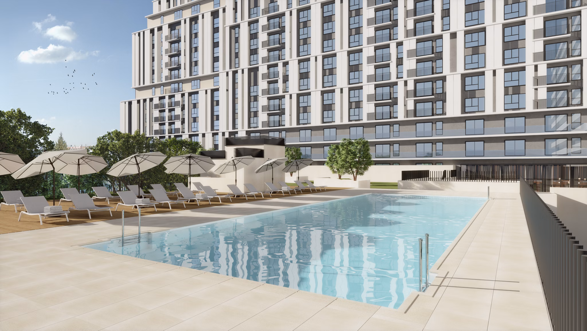 Outdoor swimming pool surrounded by modern architecture at Nera Living Atocha.