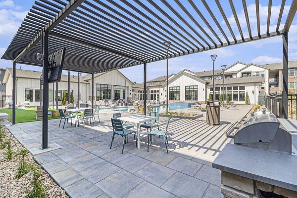 grill area/pool patio at Firestone Junction Apartments