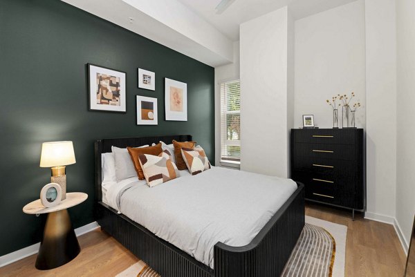 bedroom at Alexan LoSo Apartments 