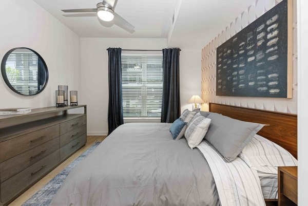 bedroom at Alexan LoSo Apartments 