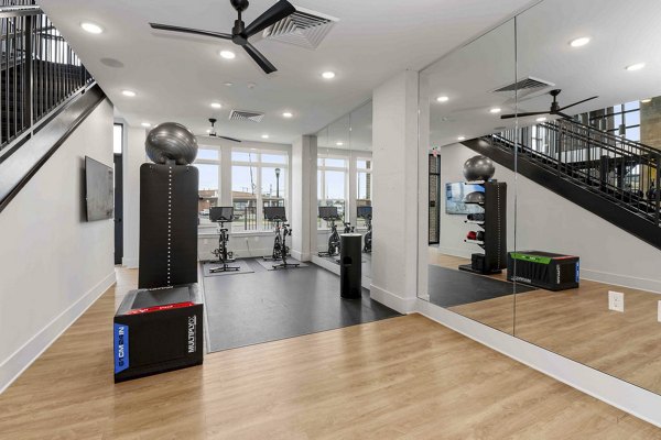 fitness center at Alexan LoSo Apartments 