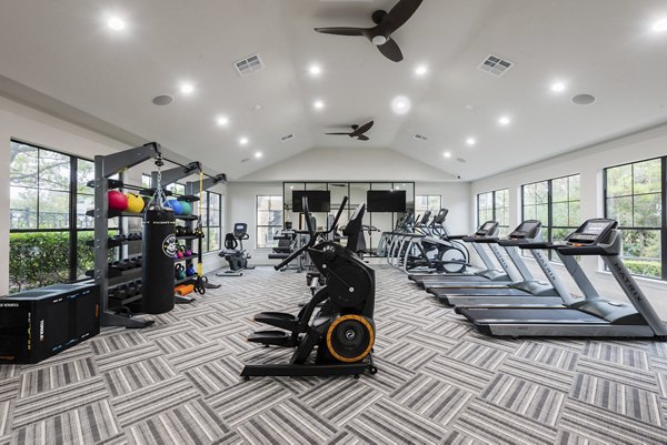 fitness center at Duo West Champions Apartments 
