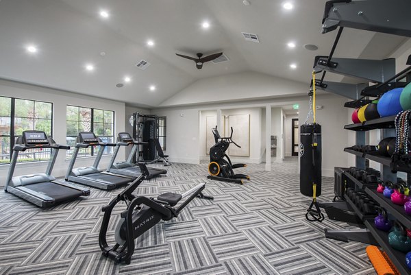 fitness center at Duo West Champions Apartments 