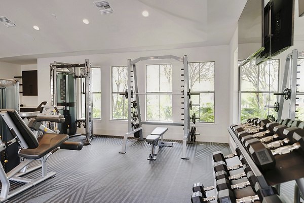 fitness center at Duo West Champions Apartments 