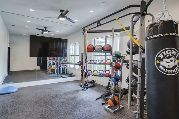 fitness center at Duo West Champions Apartments 