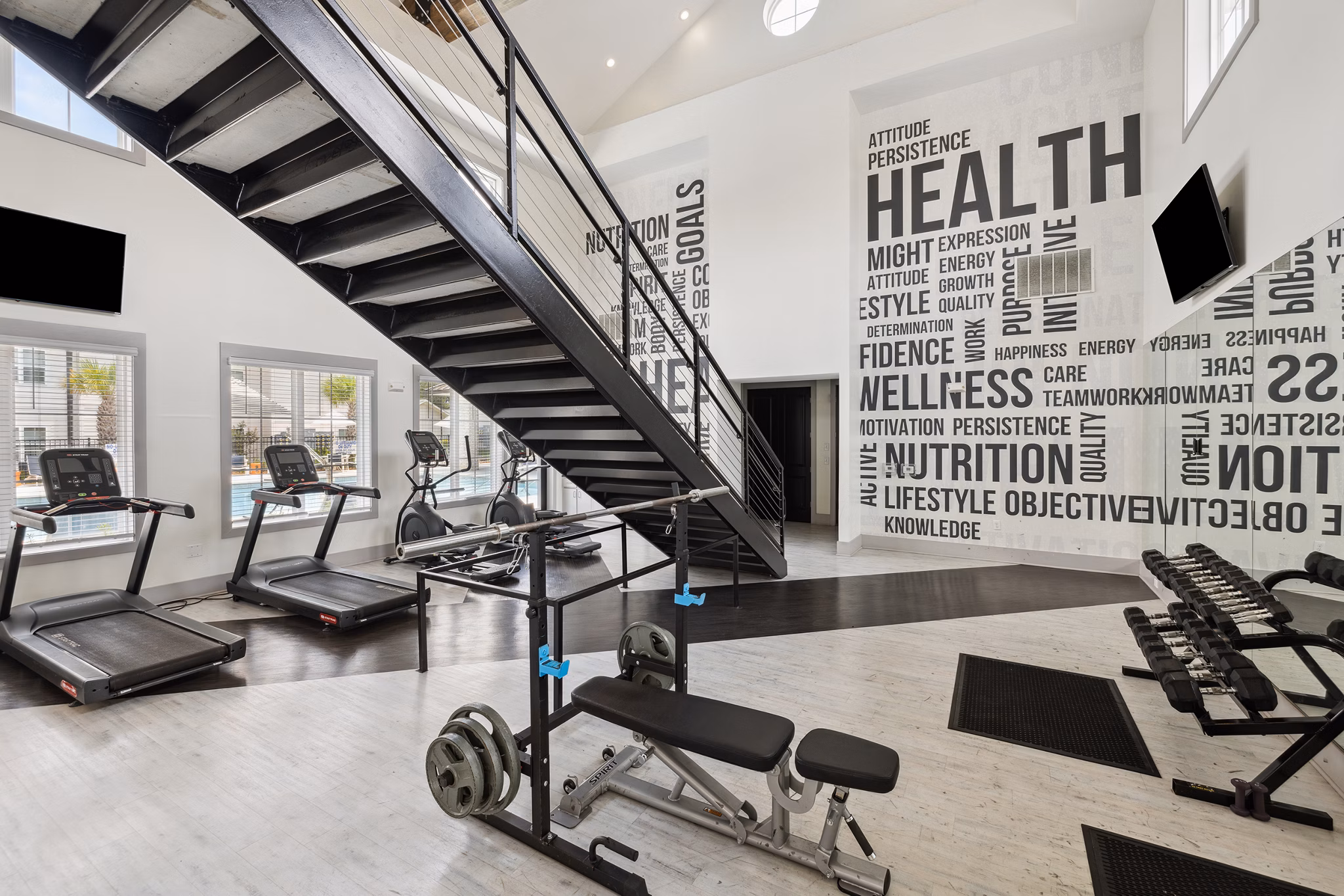fitness center at The Duke of Charleston Apartments
