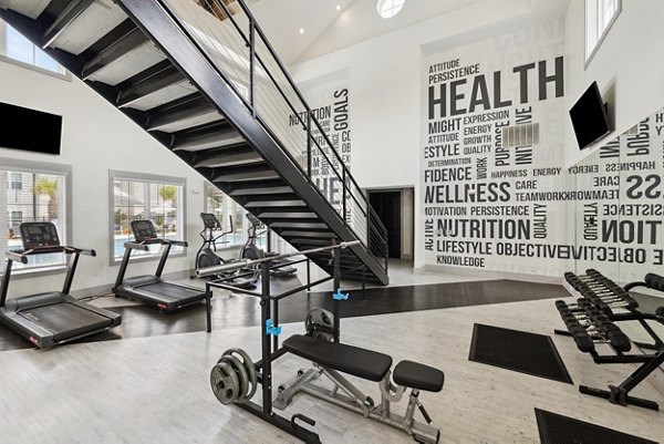 fitness center at The Duke of Charleston Apartments