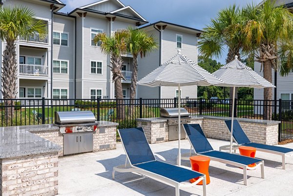 grill area/patio at The Duke of Charleston Apartments