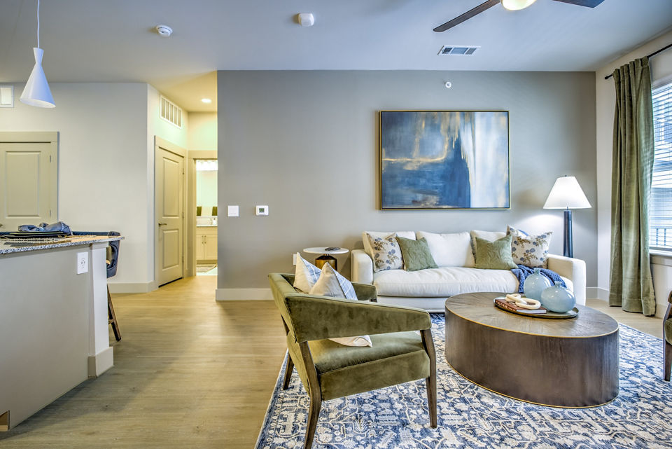 living room at Alexan at the Galleria Apartments