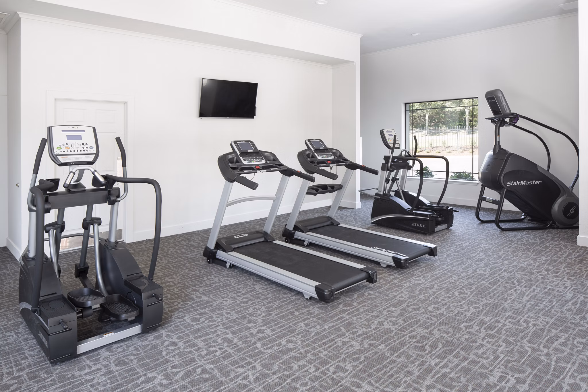 fitness center at Canyon Park Apartments