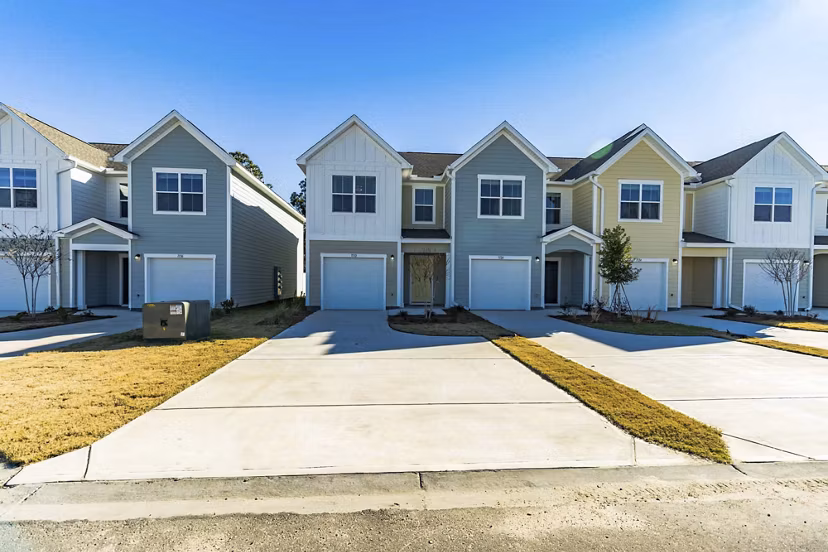 exterior at Covey Homes Grand Lagoon Apartments