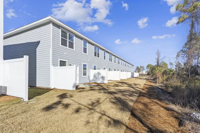 exterior at Covey Homes Grand Lagoon Apartments