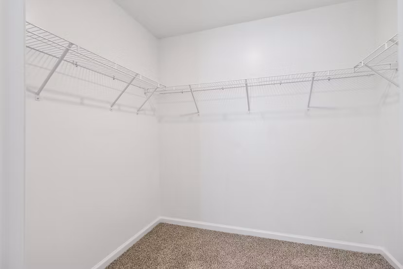 closet at Covey Homes Grand Lagoon Apartments
