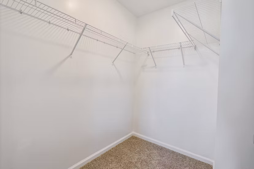 closet at Covey Homes Grand Lagoon Apartments