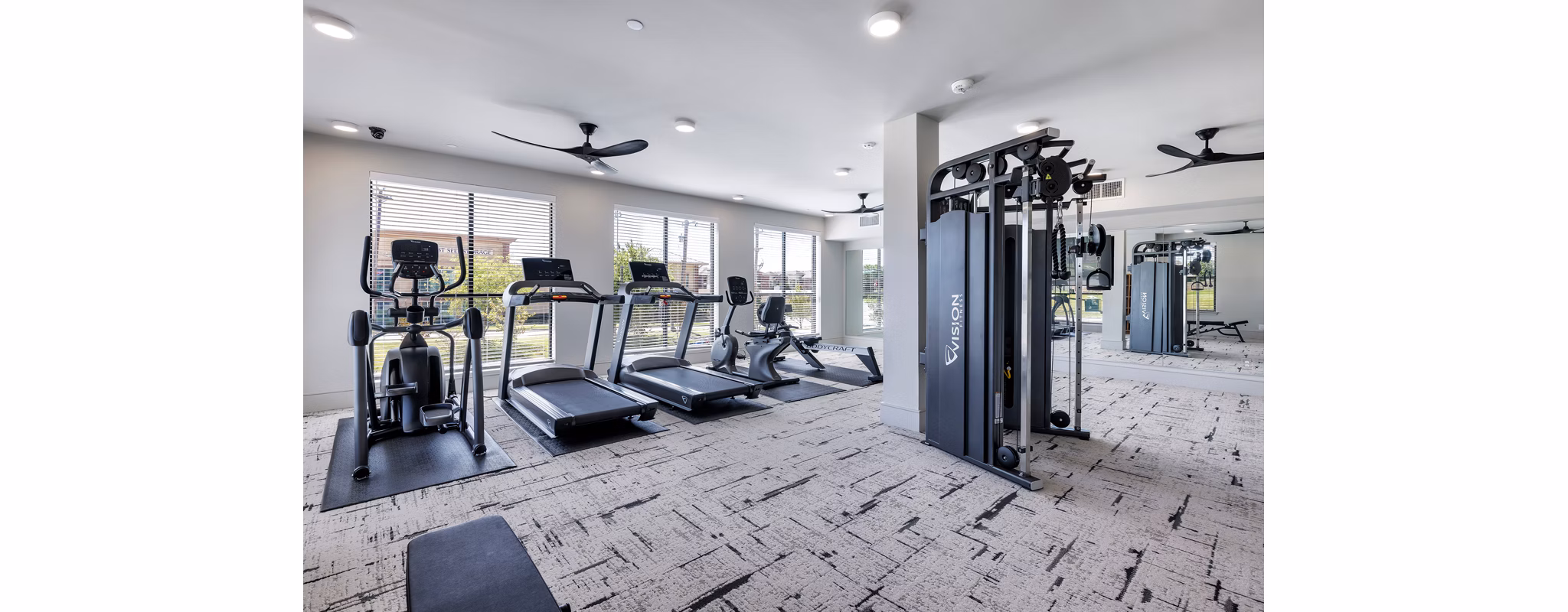 fitness center at The Luxe at Lewisville Apartments
