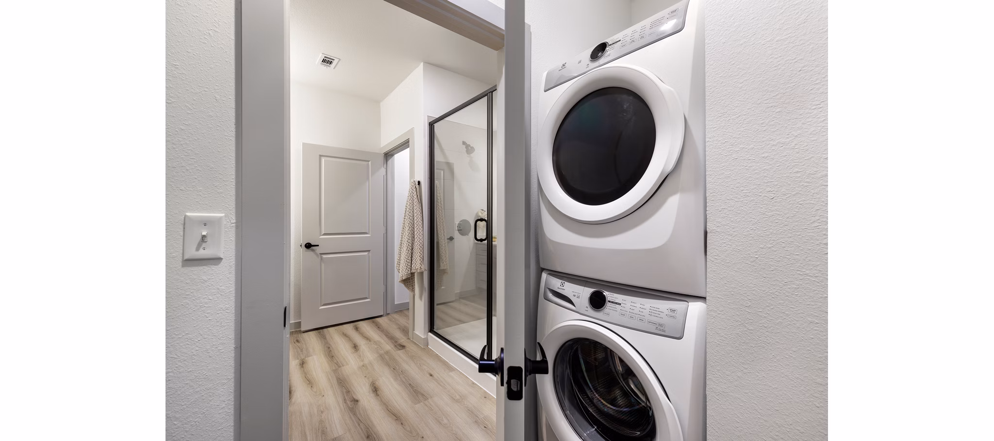 laundry room at The Luxe at Lewisville Apartments