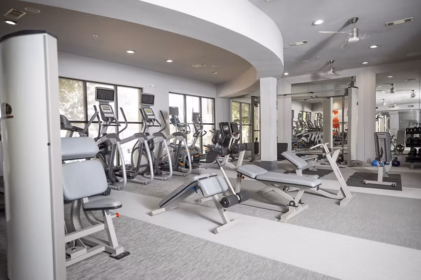 fitness center at The Briscoe River Oaks Apartments