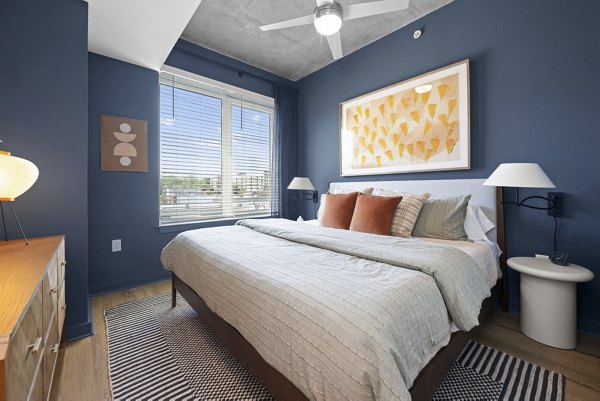 bedroom at Alexan Moto Apartments