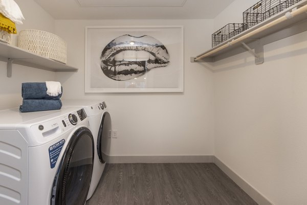 laundry room at Elysian at Sunset Apartments