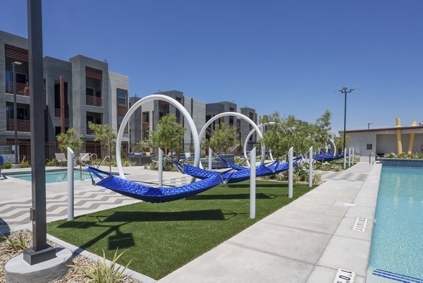 hammock/patio/pool area at Elysian at Sunset Apartments