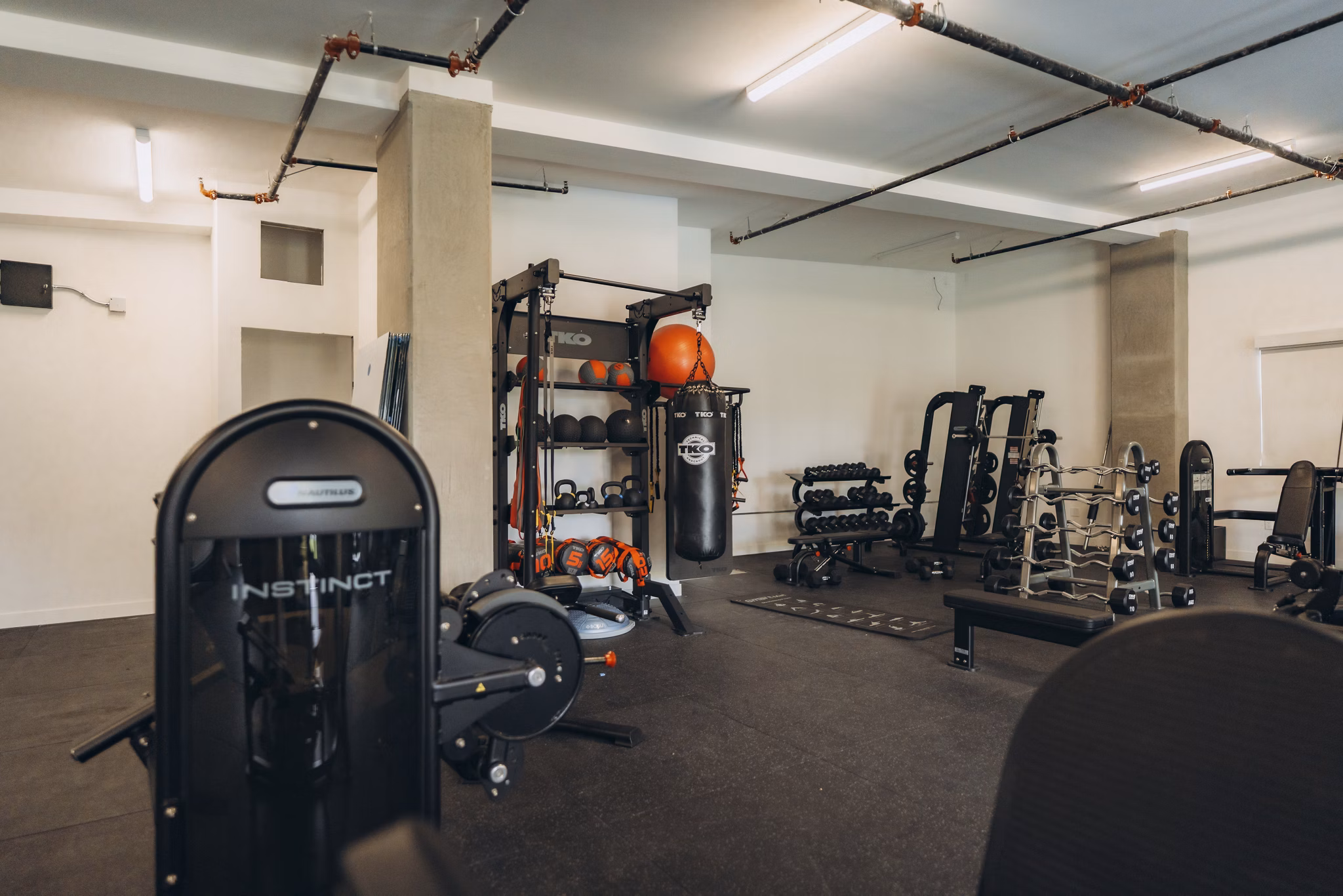 fitness center at TENTEN Campus Glendale Apartments 