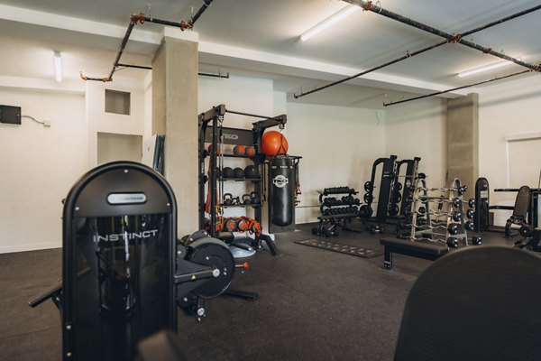 fitness center at TENTEN Campus Glendale Apartments 