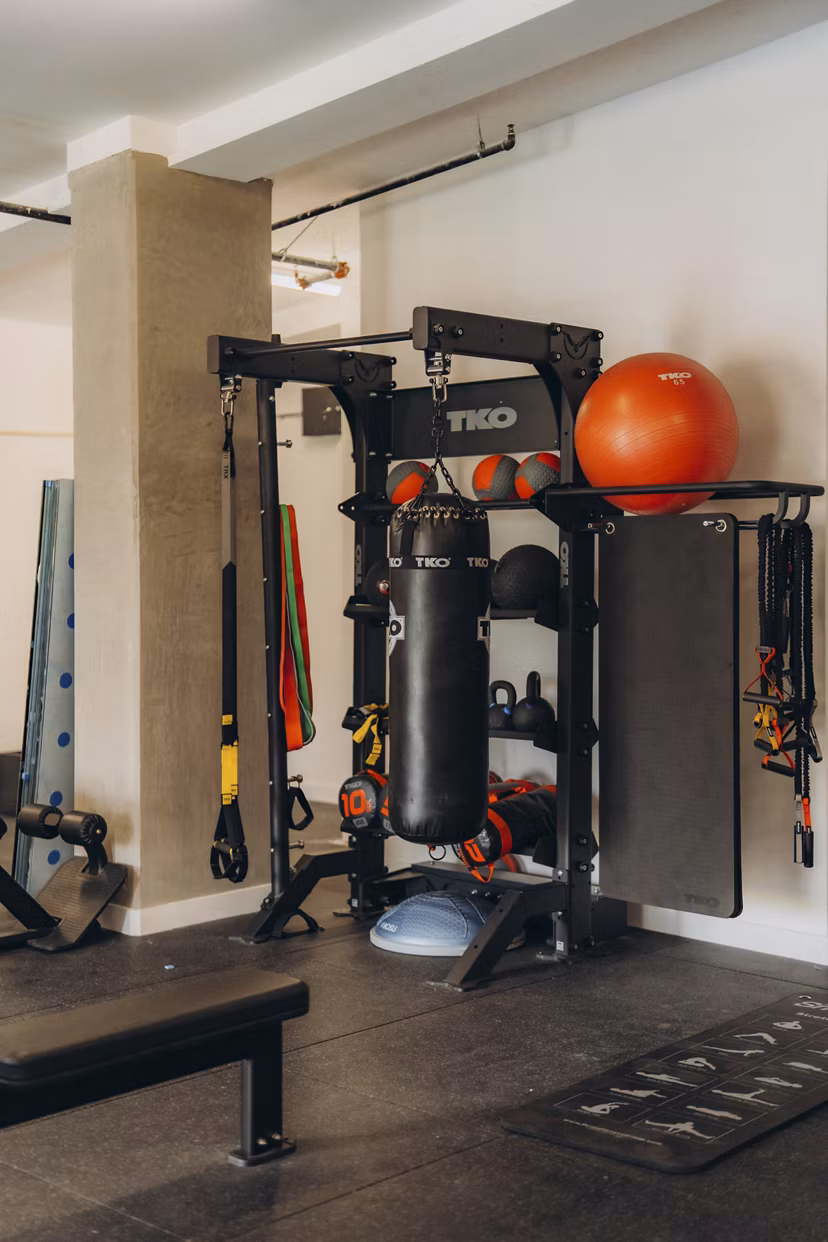 fitness center at TENTEN Campus Glendale Apartments 