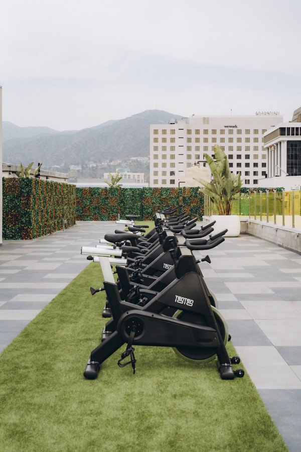 fitness center at TENTEN Campus Glendale Apartments 