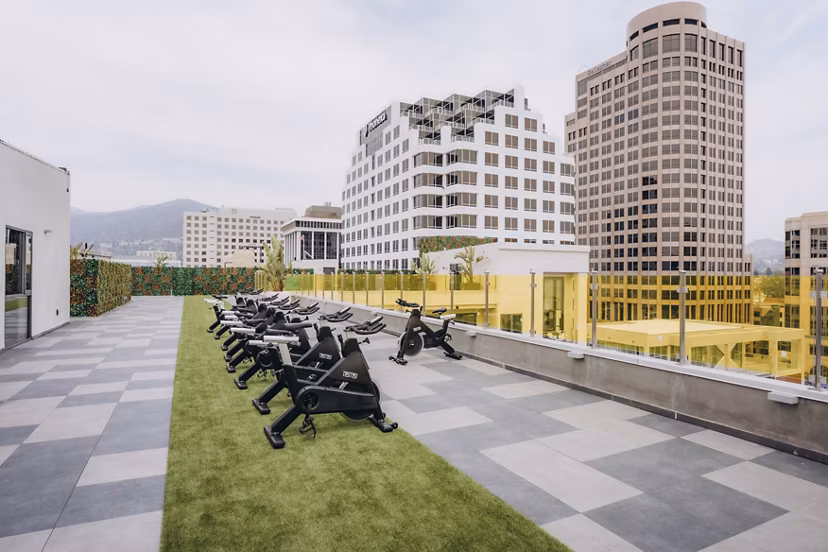 fitness center at TENTEN Campus Glendale Apartments 