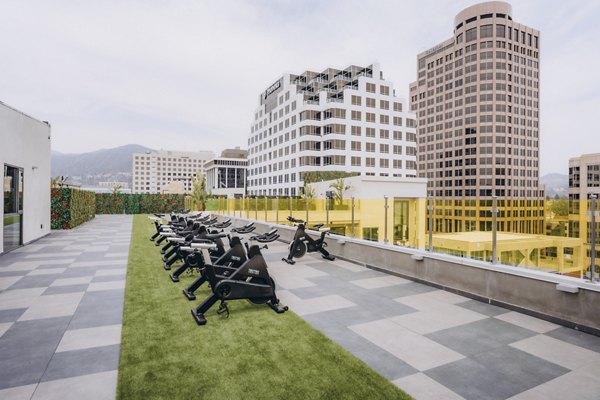 fitness center at TENTEN Campus Glendale Apartments 