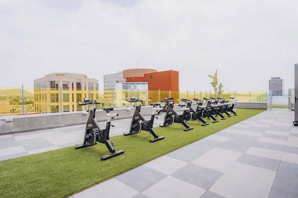 fitness center at TENTEN Campus Glendale Apartments 