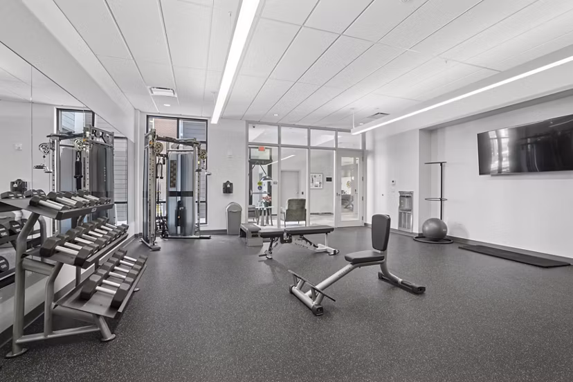 fitness center at The Block at Odell Apartments