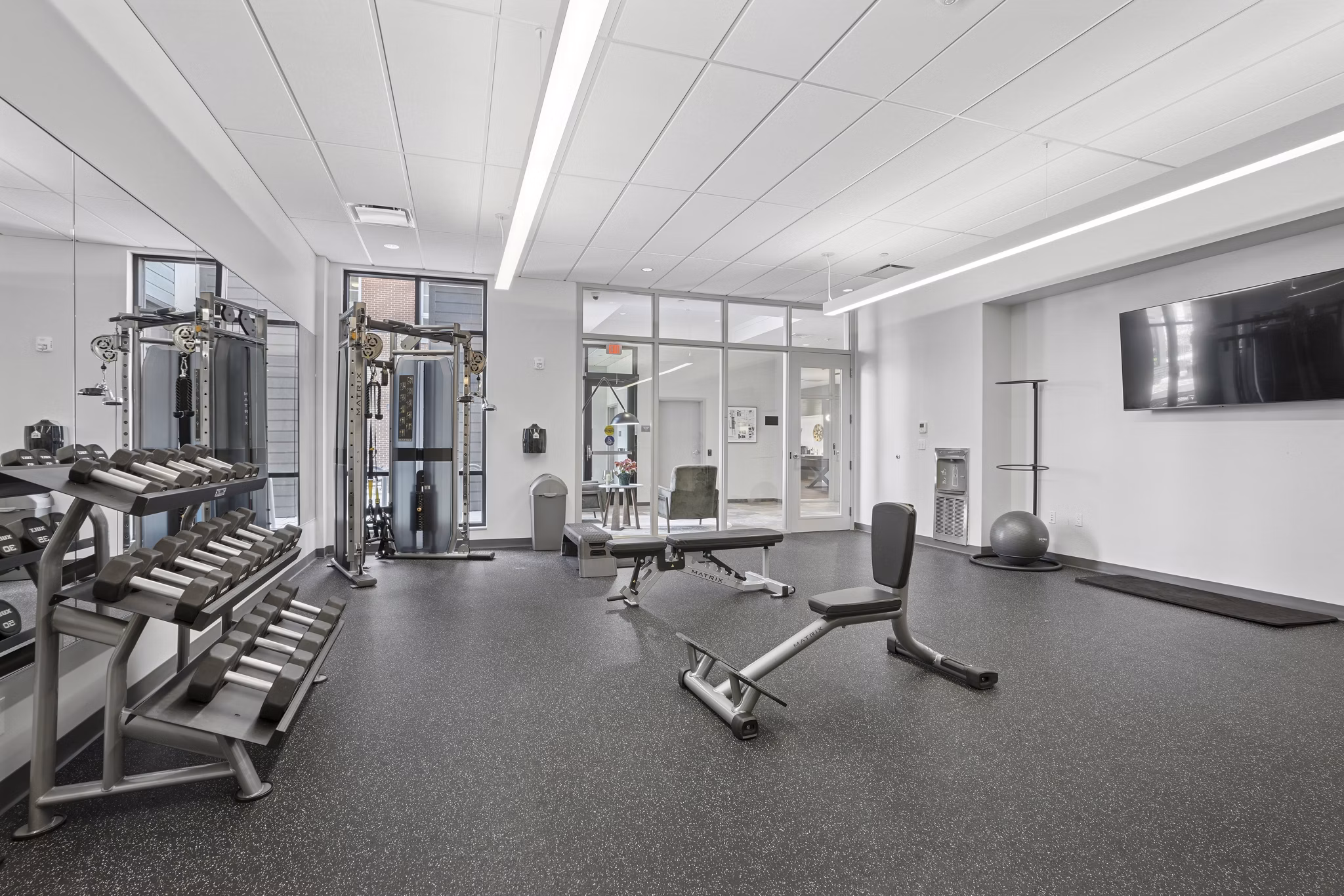 fitness center at The Block at Odell Apartments